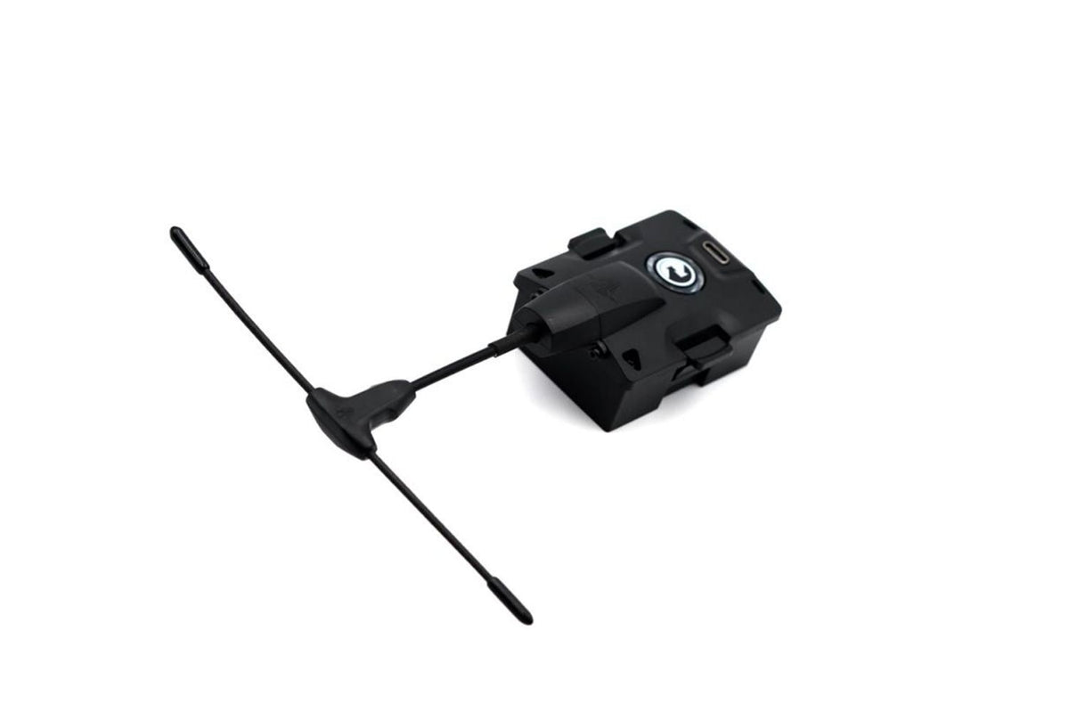 A black electronic device with a small T-shaped antenna, shown on a plain white background.