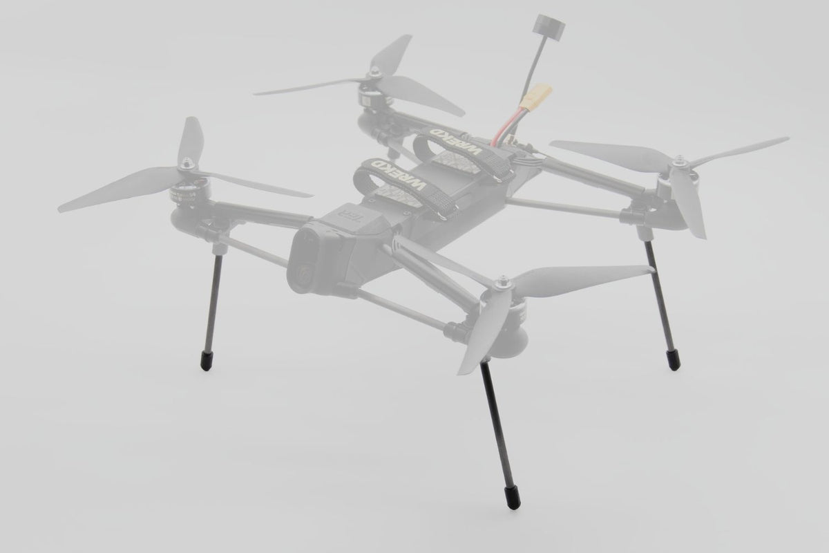 A light gray quadcopter drone with four propellers and landing legs, shown against a plain light gray background.
