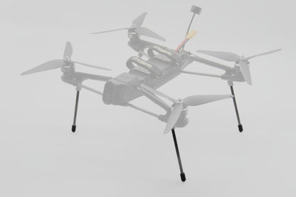 A light gray quadcopter drone with four propellers and landing legs, shown against a plain light gray background.