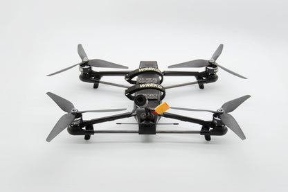 Black quadcopter drones with gray propellers, drone features a mounted camera 