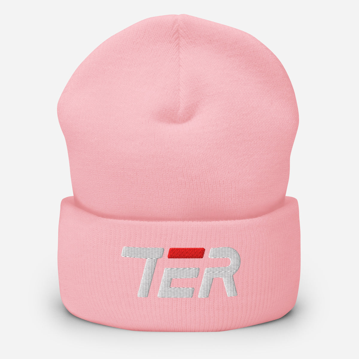A light pink knit beanie hat with a folded cuff, featuring a white embroidered 'TER' logo with a red accent bar on the front, set against a plain light gray background.