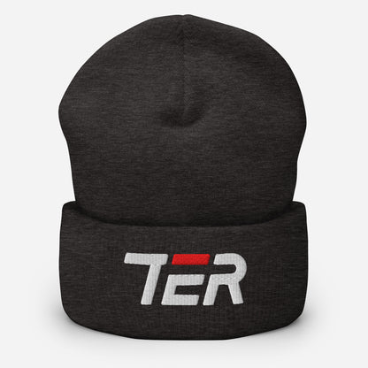 A dark heather gray knit beanie hat with a folded cuff, featuring a white embroidered 'TER' logo with a red accent bar on the front, set against a plain light gray background.