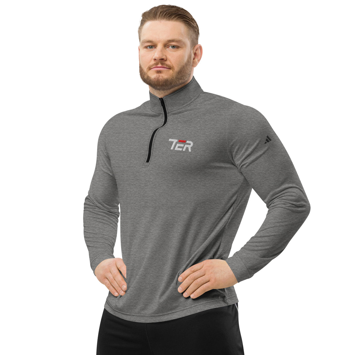 Man wearing a gray long-sleeve shirt with a logo on a white background