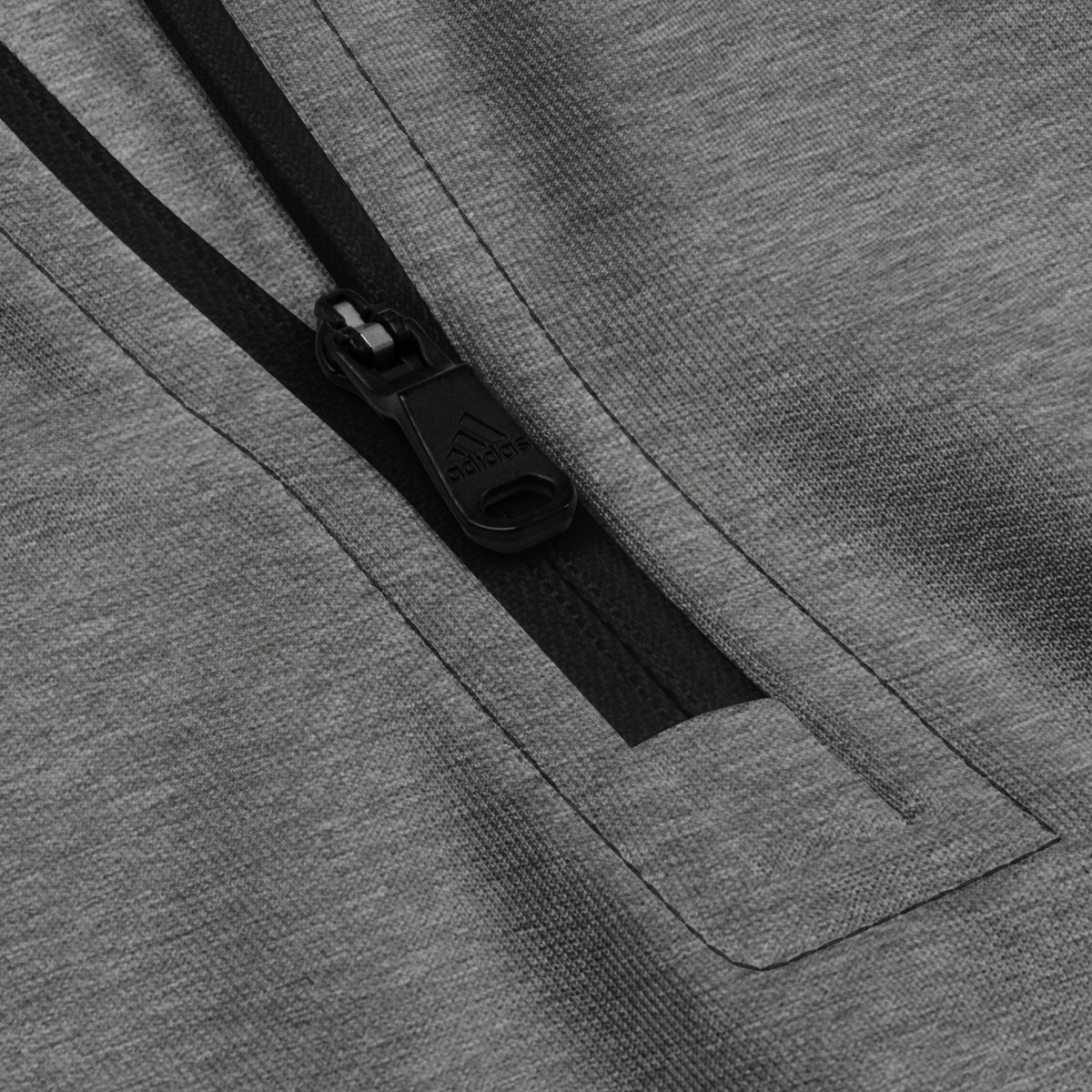 Close-up of a gray fabric with a zipper pocket