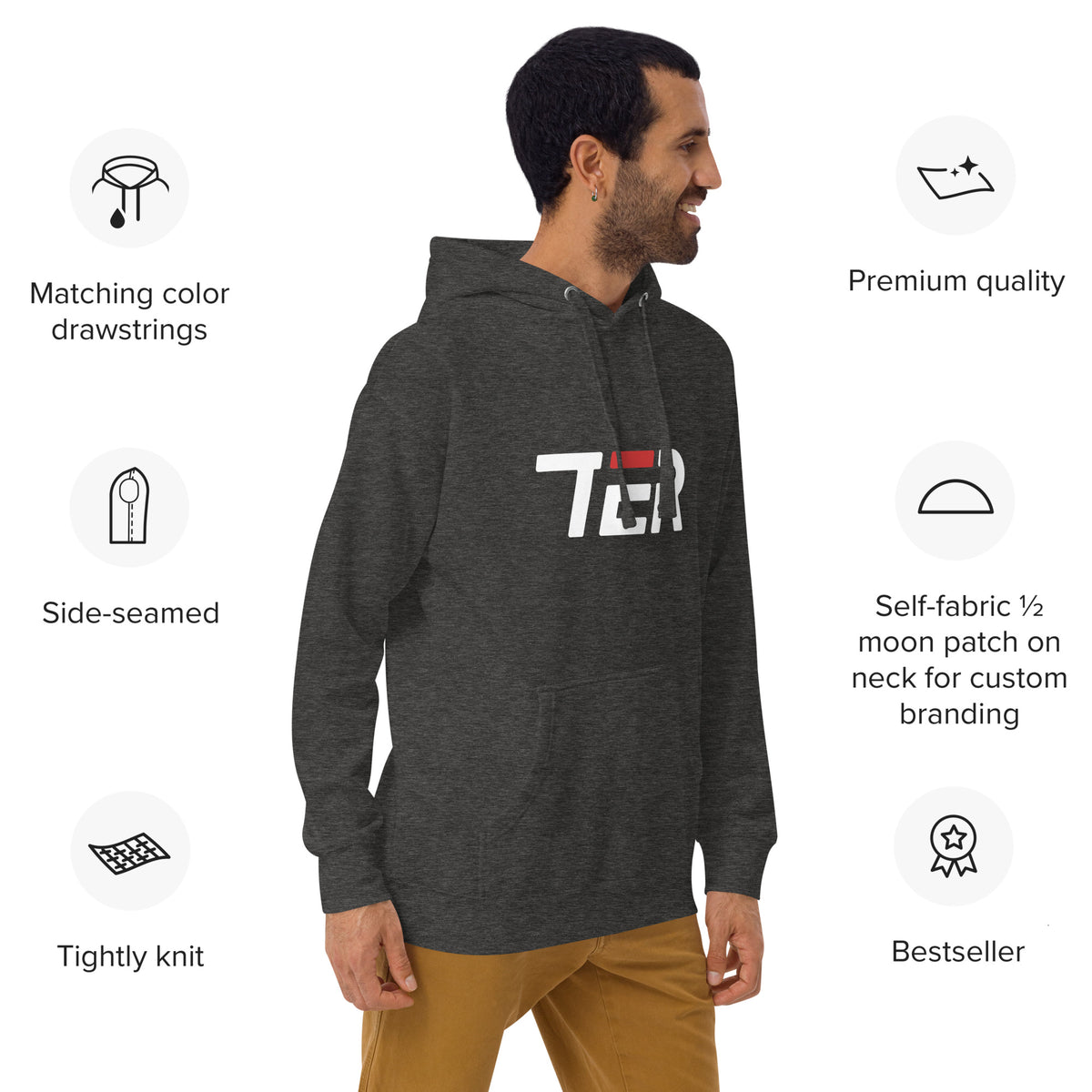 Man wearing a gray hoodie with a colorful graphic and text, standing against a white background with product features listed.