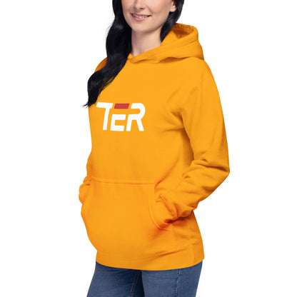 A woman wearing a gold hoodie with a white and red 'TER' graphic on the chest, paired with blue jeans, shown against a plain white background.