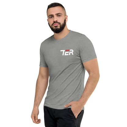 Man wearing a gray t-shirt with a logo on a white background