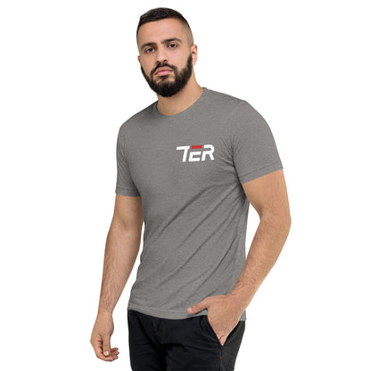 A man wearing a heather gray crewneck t-shirt with a white and red 'TER' logo on the chest, paired with black pants, set against a plain white background.