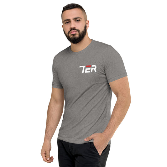 A man wearing a heather gray crewneck t-shirt with a white and red 'TER' logo on the chest, paired with black pants, set against a plain white background.