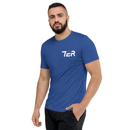 Man wearing a blue t-shirt with a logo on a white background